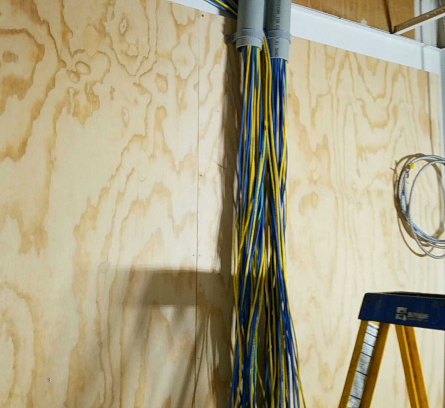 NetWerks structured cabling — conduit drop and raw cable installation in progress